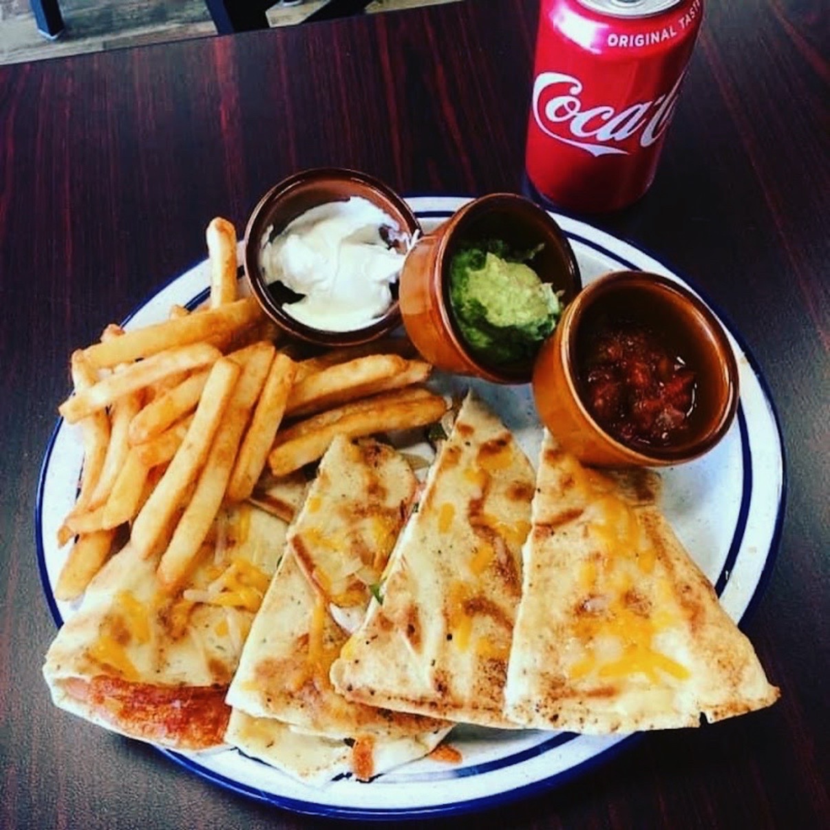 Quesadilla wedges with fries, salsa, guacamole and sour cream